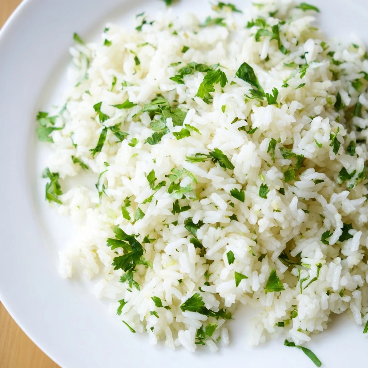 Vibrant photo of cilantro lime rice, a fragrant side dish with lime wedges, ready to serve and enjoy.