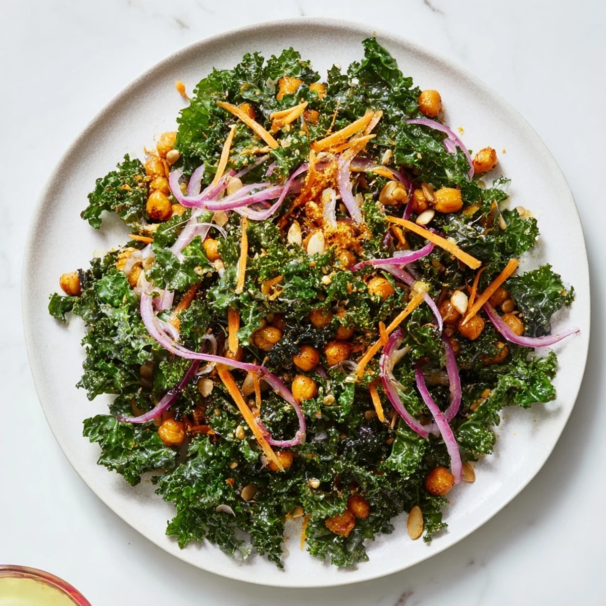 Vibrant Kale Salad with Roasted Chickpeas, with crunchy spiced chickpeas atop the fresh, green salad.