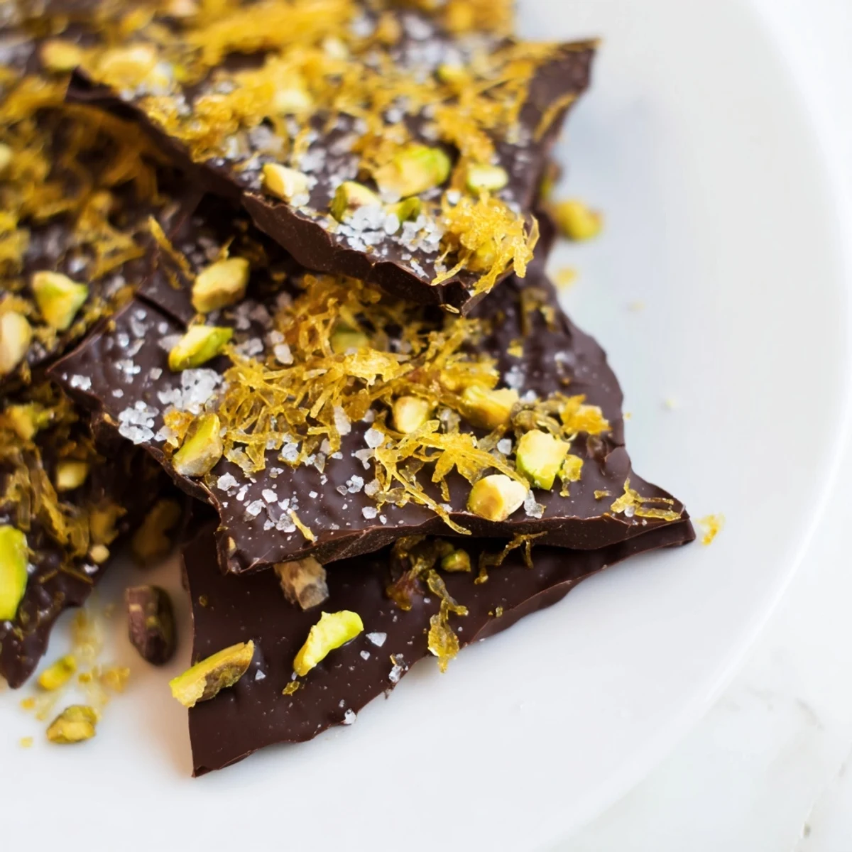 Golden kataifi chocolate crunch bark, a stunning dessert with crispy phyllo and chopped pistachios.