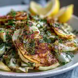Tossing green cabbage with garlic and Mediterranean spices, this quick skillet side is vegan, gluten-free, and ideal alongside grilled fish or chicken.