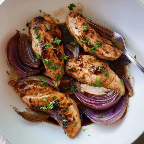 One-pan balsamic glazed chicken and red onions roasted together, drizzled with savory pan juices.
