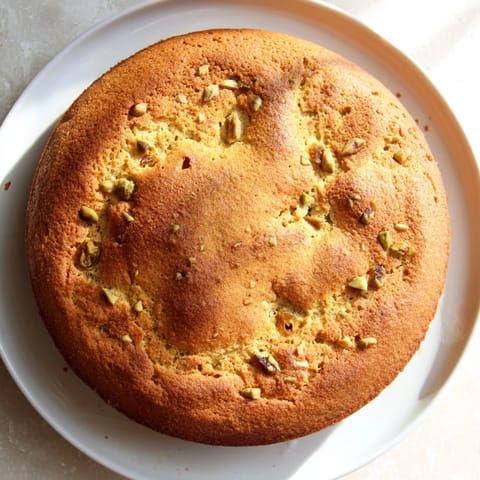 Close-up of freshly baked soft-baked oatmeal raisin breakfast cookies, with visible raisins and oat texture.