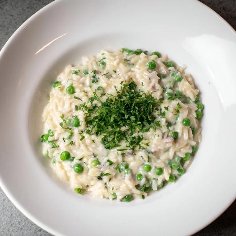 One-pan Creamy Parmesan Orzo with Green Peas, a vegetarian delight ready in under 30 minutes.