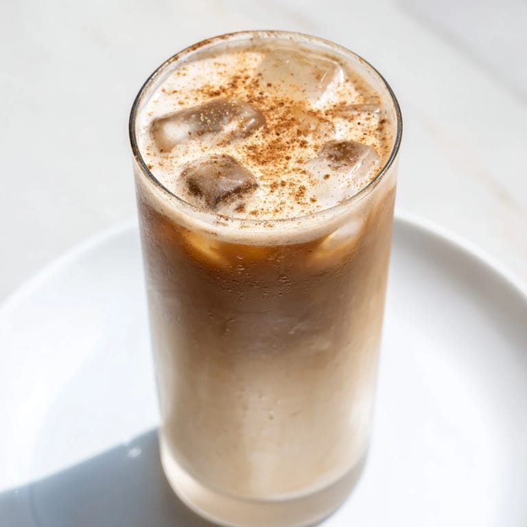 A tall glass of homemade Proffee Power Blend, a quick and delicious protein-packed iced latte.