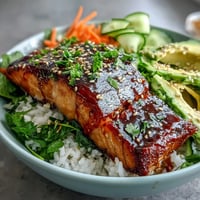 15-Minute Teriyaki Salmon Bowl with glazed salmon, fresh veggies, and rice, perfect for a quick dinner.